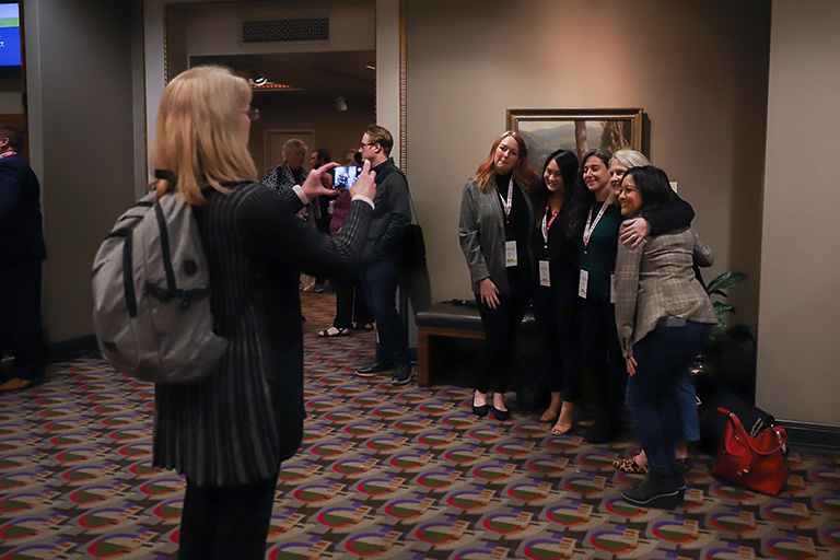 Attendees are happy to gather in person at the conference Tech Expo.