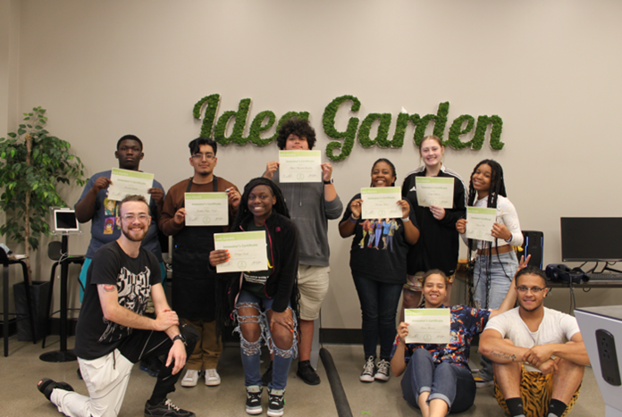 Group of students holding Innovator's Certificate.