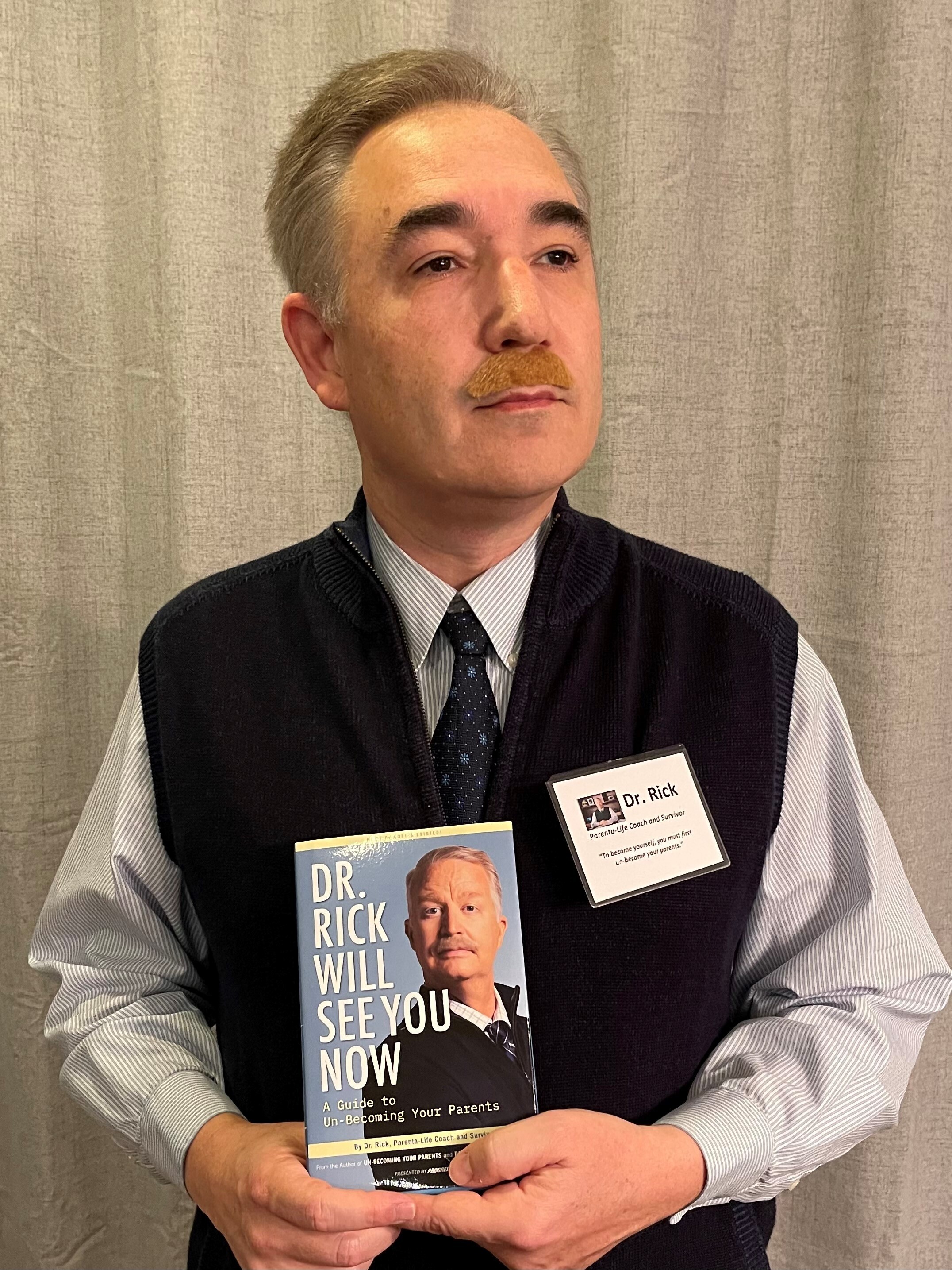 UITS staff member poses as Dr. Rick from the Progressive commercial for Halloween.