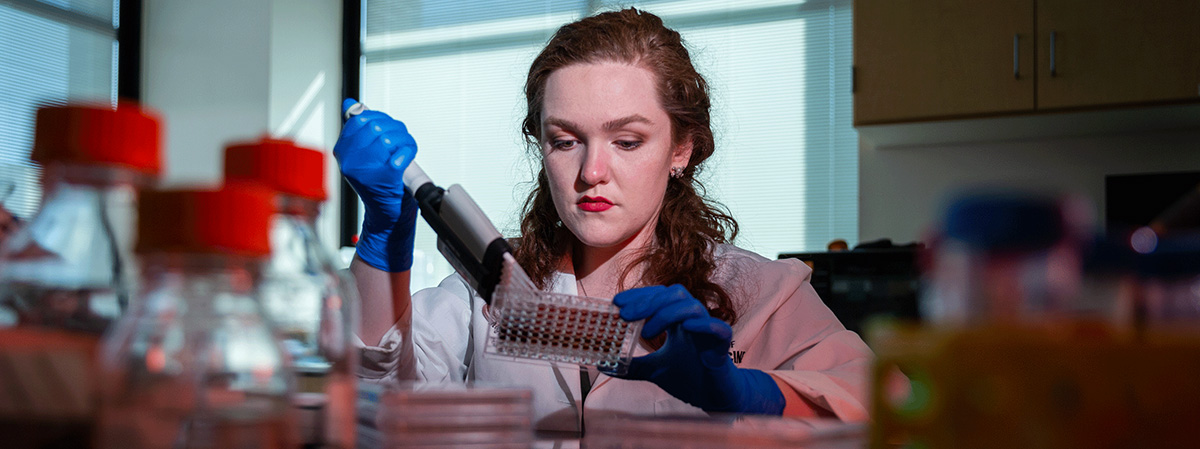 Graduate student working in lab