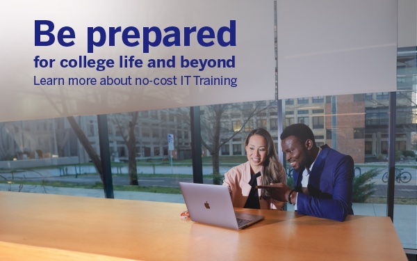 Students looking at a laptop