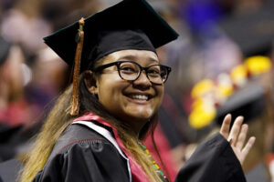 A graduate stands for recognition during the IU South Bend Commencement at the University of Notre Dame on Tuesday, May 7, 2019.