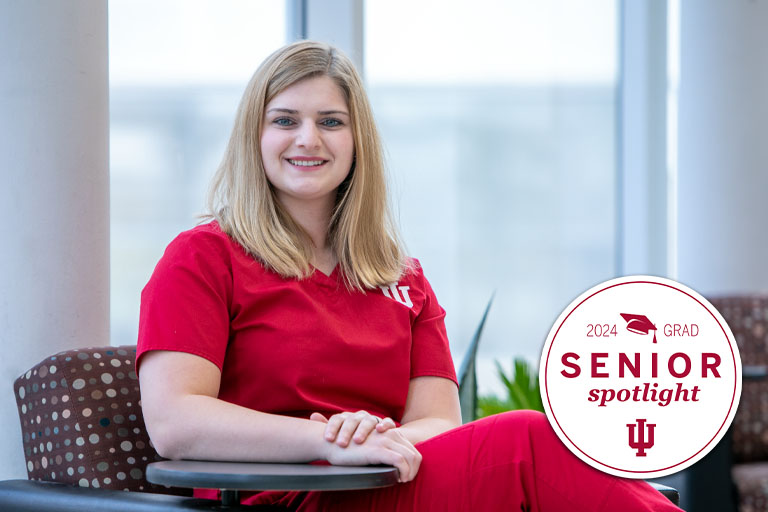 A woman wearing red scrubs