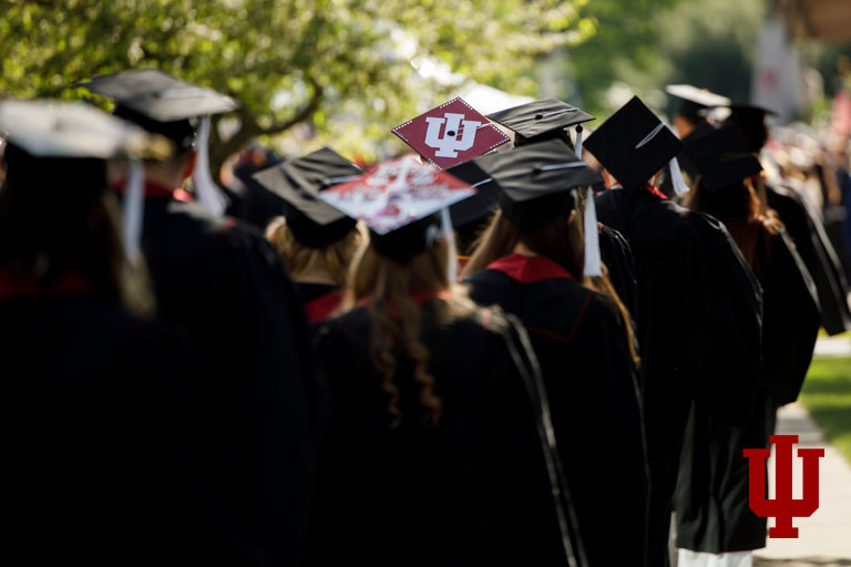 Image of graduation caps from behind