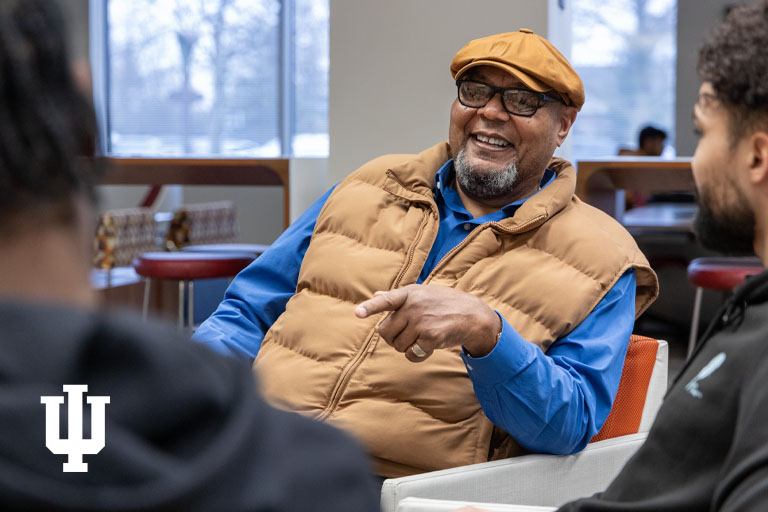A man sits on a chair