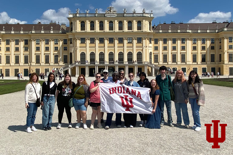 A group picture in front of a European castle