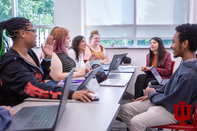 A group of people work around a table