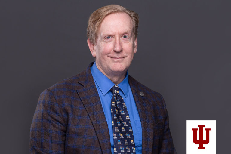 A portrait of a man in a suit