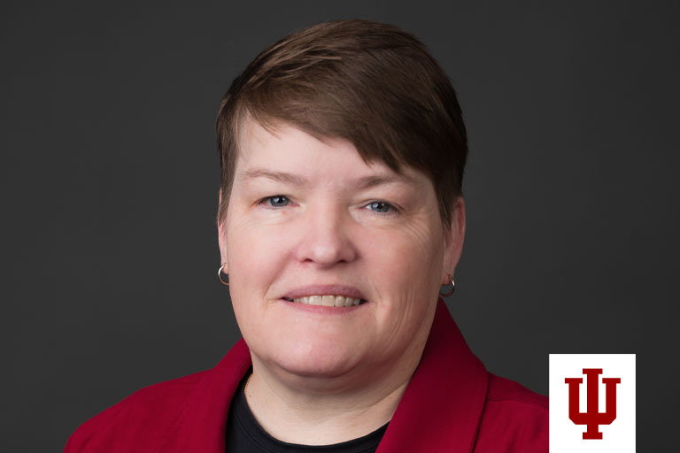 Portrait of a woman in a red suit