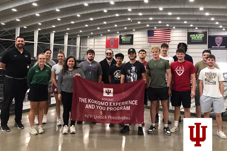 A group picture with an IU flag