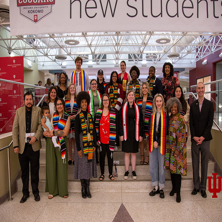 A group picture of people with colorful stoles
