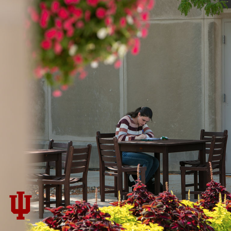 A student studies at a table