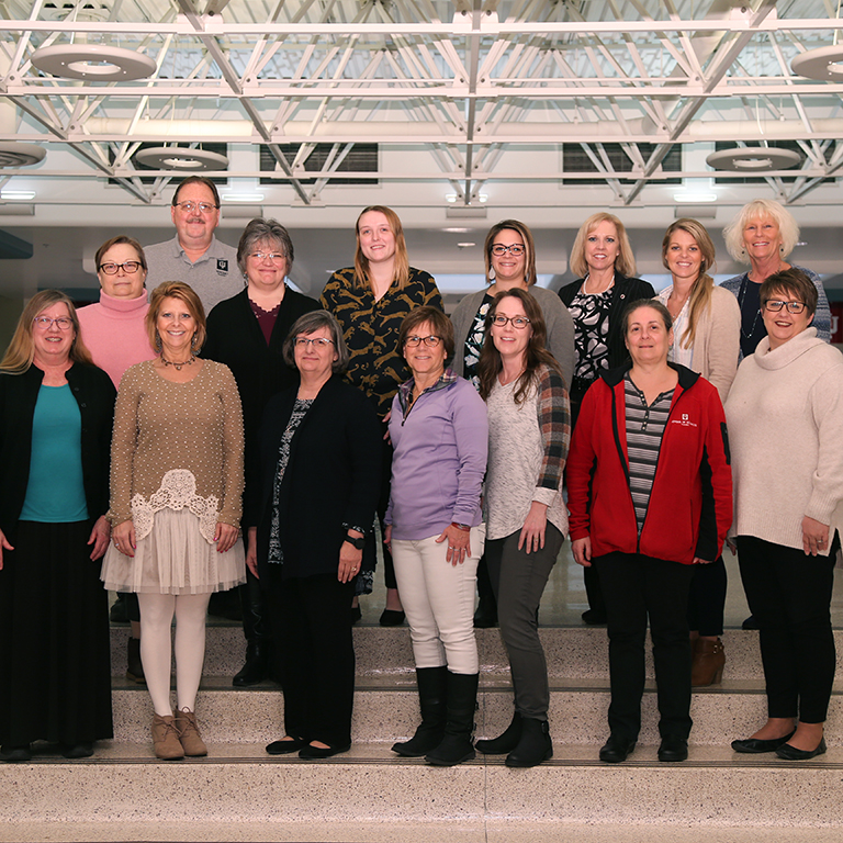 A group of people pose for a portrait.