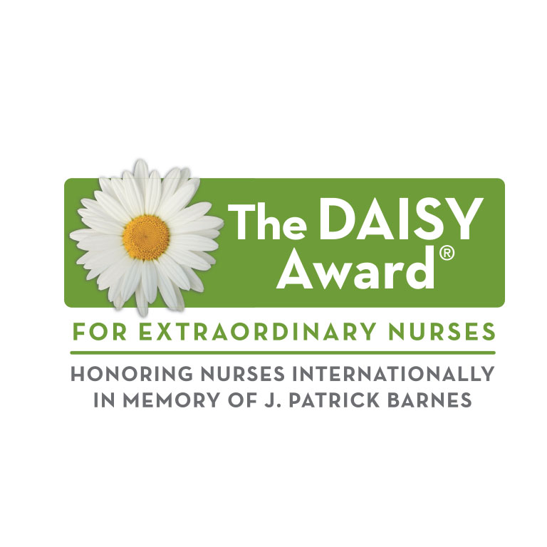 A green background with a white daisy and the words The Daisy Awards