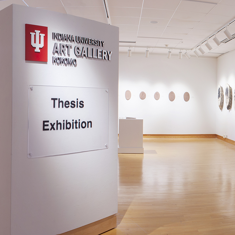 The IU Kokomo Art Gallery with a senior thesis exhibition sign