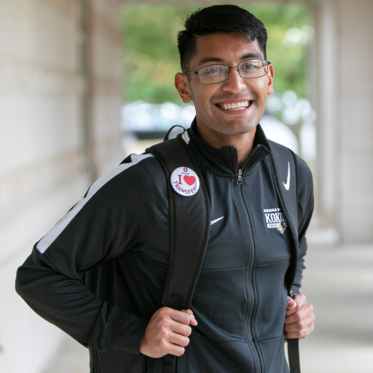 A man smiles for a picture