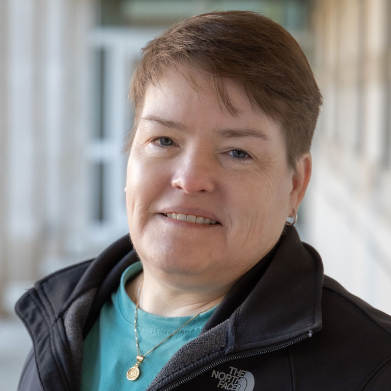 a woman poses for a picture