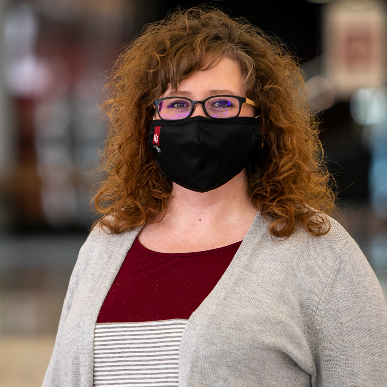 A woman in a black mask