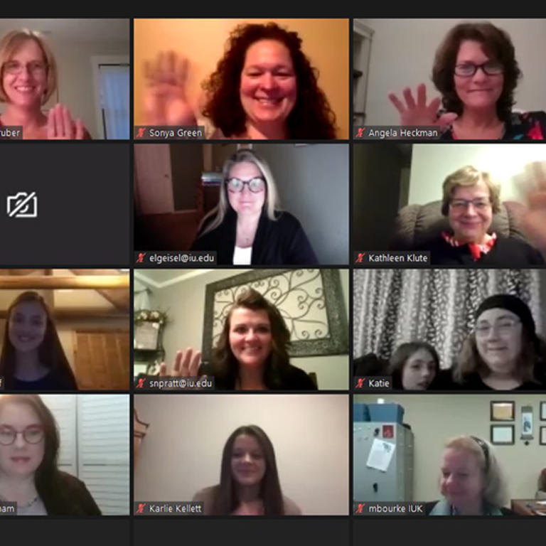 A grid of Zoom call attendees