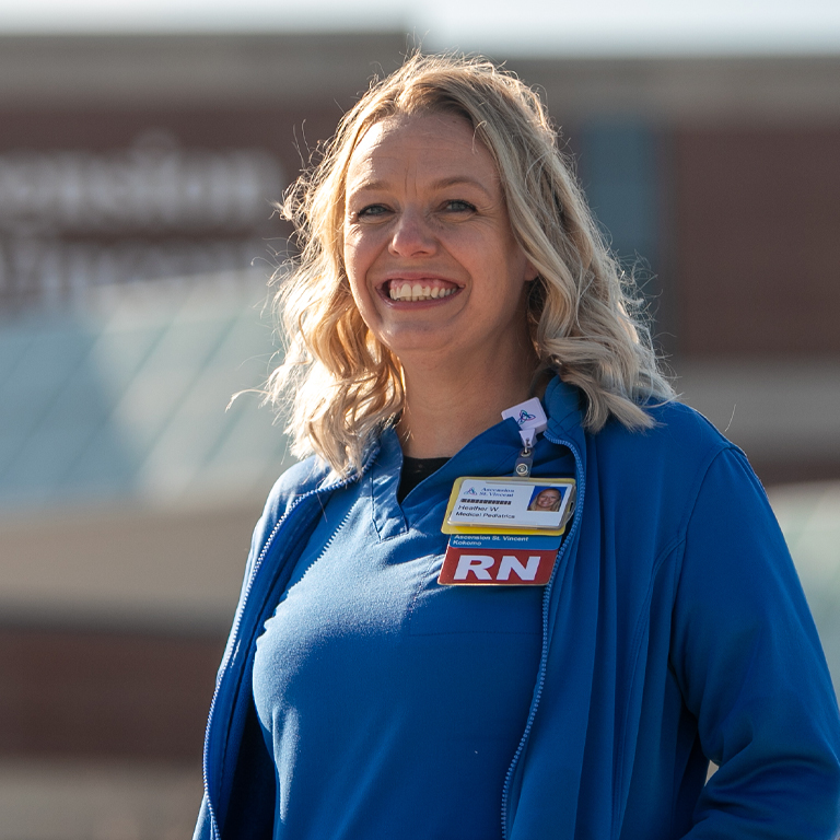A woman in nurses scrubs