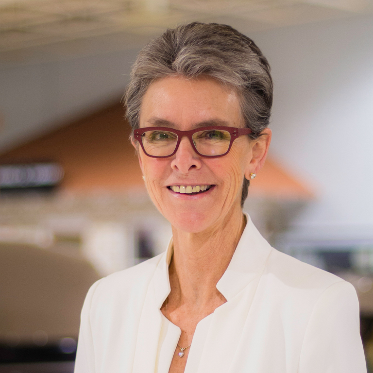 A woman poses for a portrait