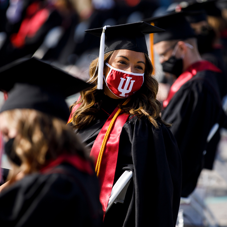A woman in a graduation cap and gown