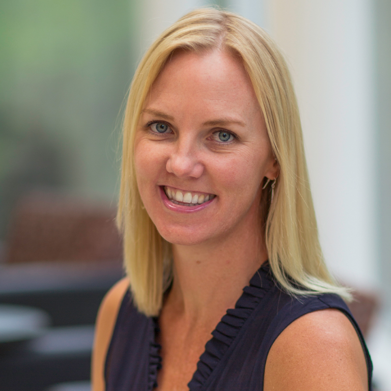 A woman poses for a portrait