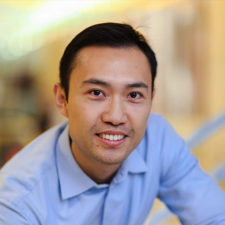 A man poses for a portrait