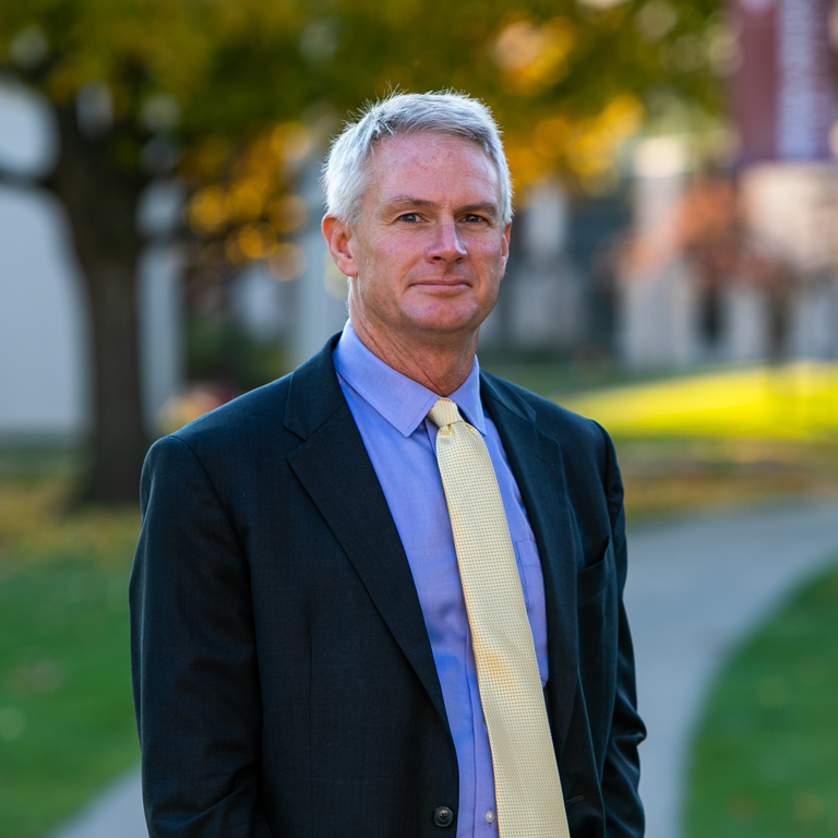 A man poses for a portrait