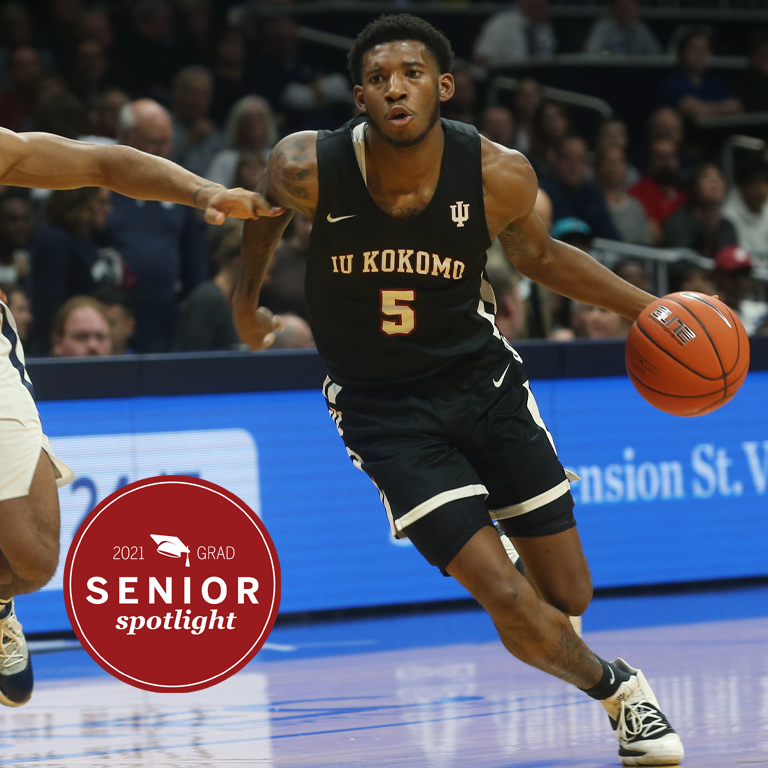 A man dribbles a basketball