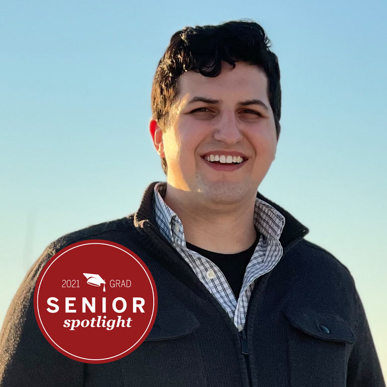 A man smiles for a picture