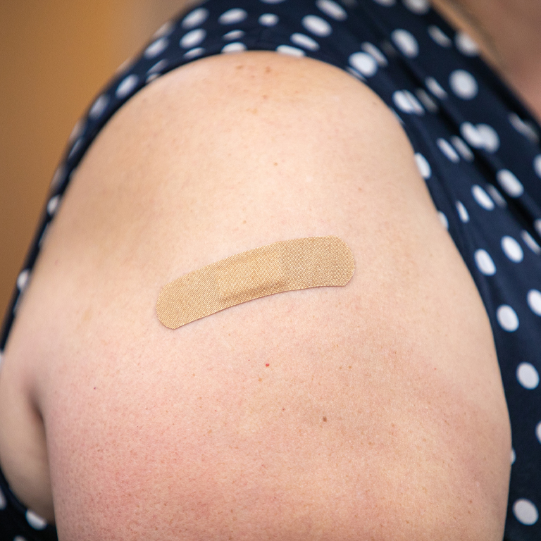 A bandage on a bare arm