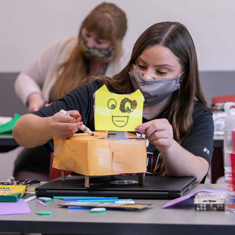 A woman makes an art project