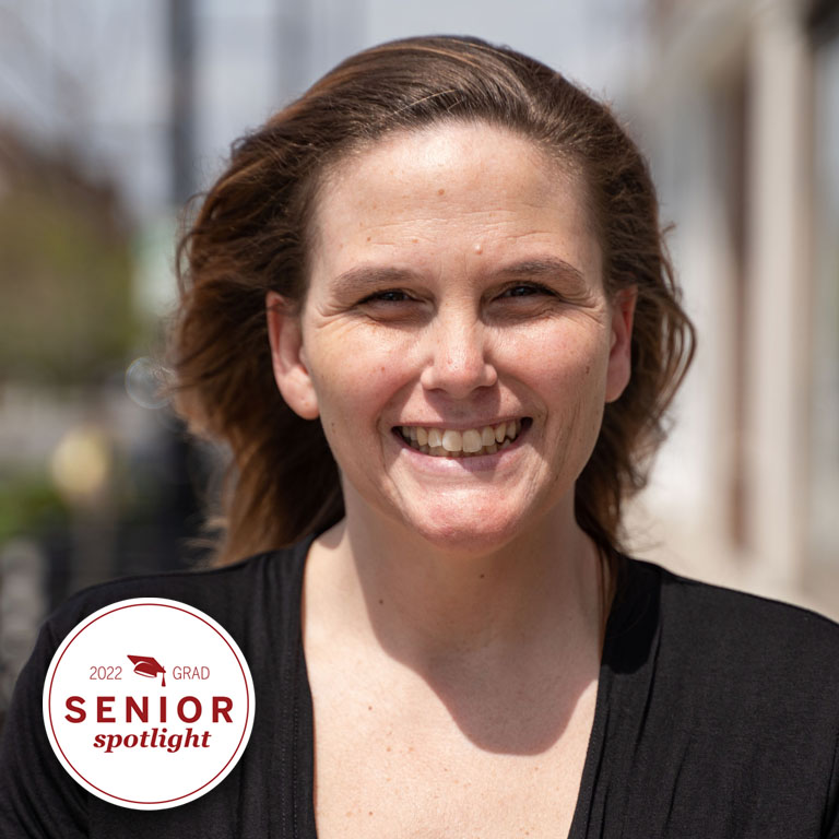 A woman smiles for a picture
