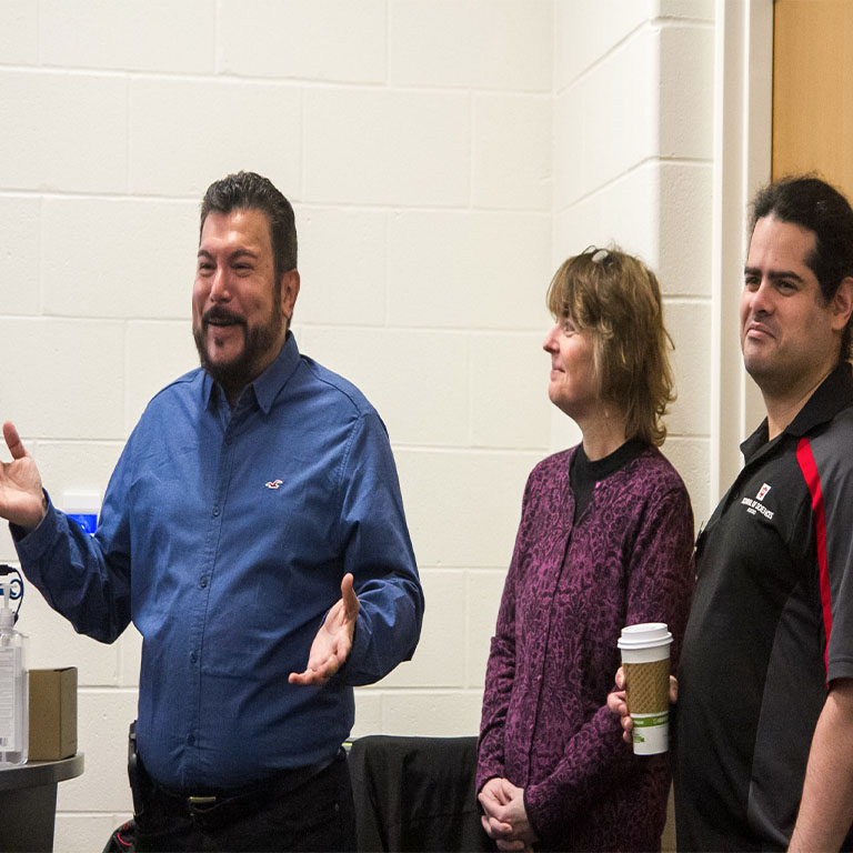 Two men and a woman make a presentation