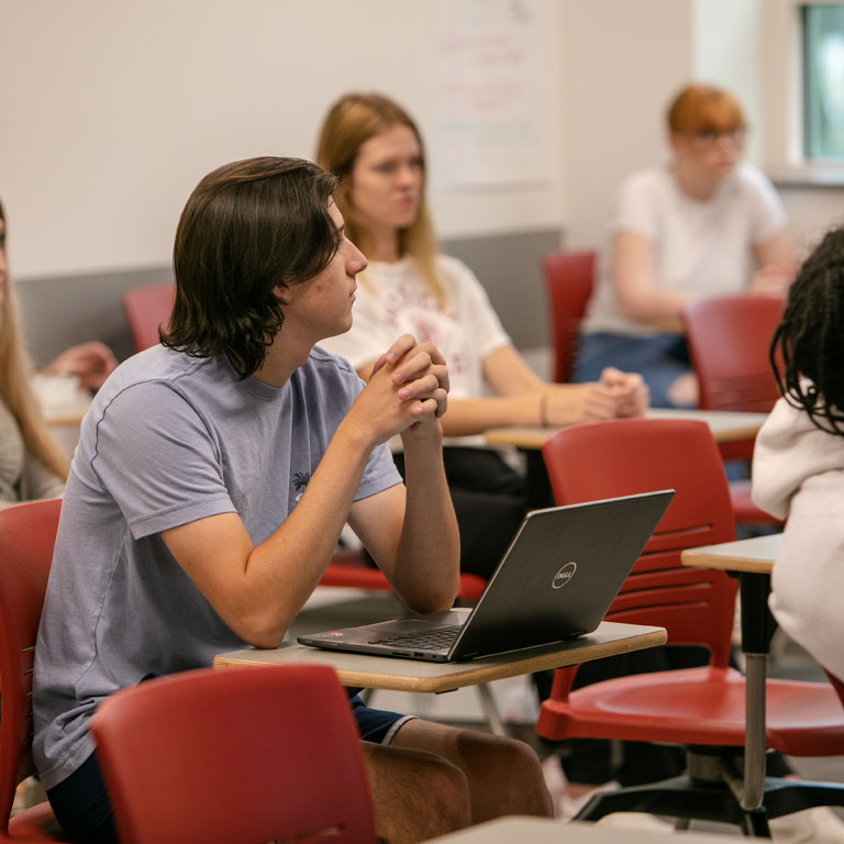 Students sit in a classroom