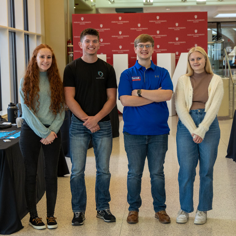 Two men and two women pose for a picture