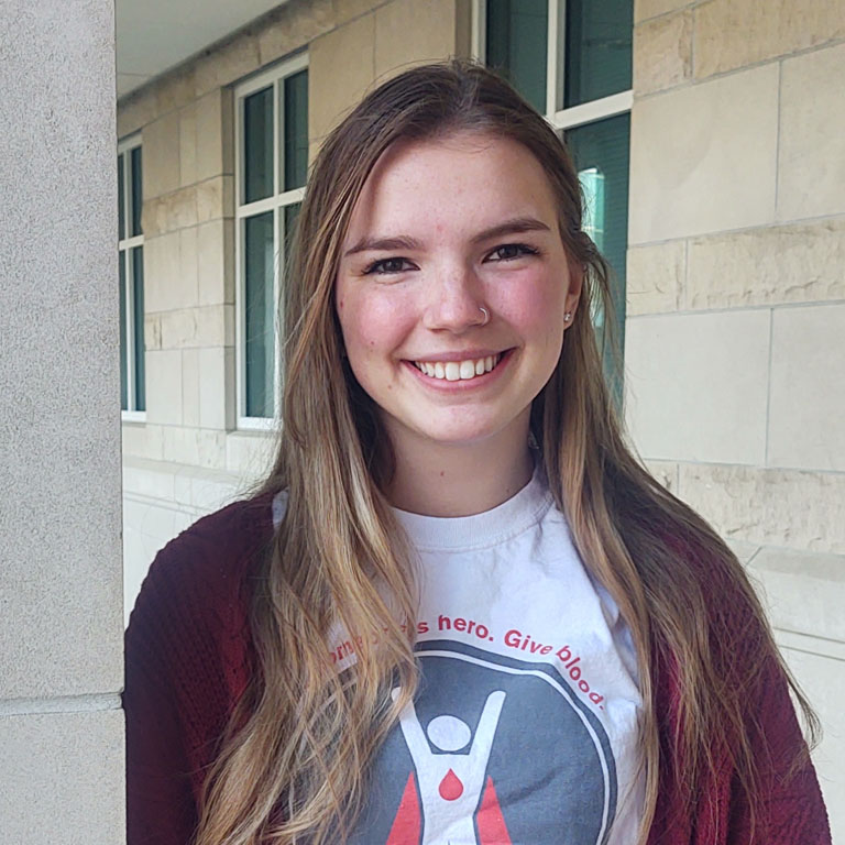 A woman smiles for a picture