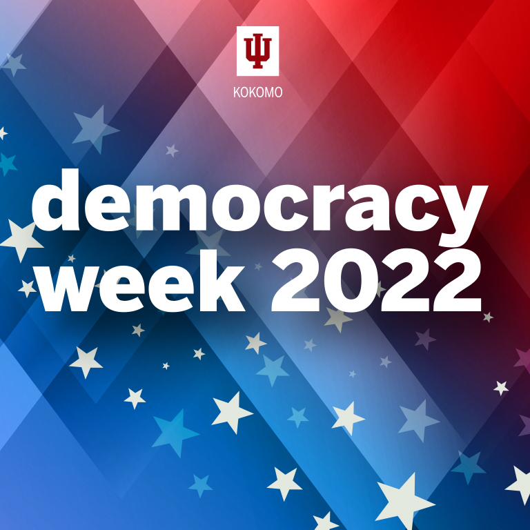 The words Democracy Week 2022 on a red white and blue background