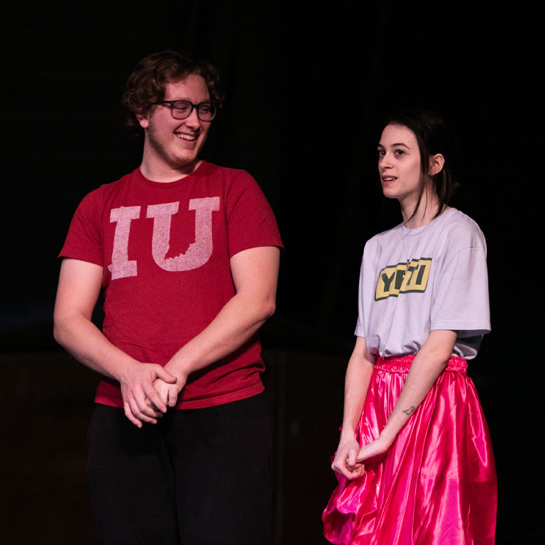 A man and a woman on a stage
