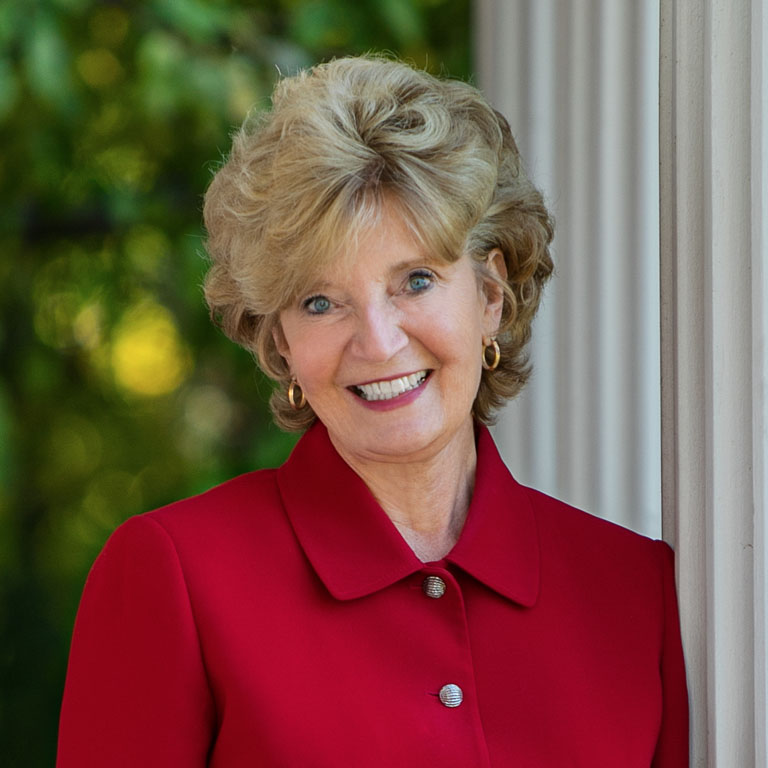 A woman in a red suit