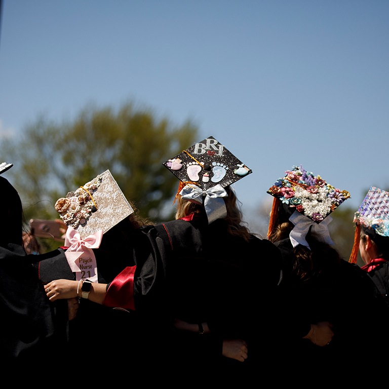 Decorated graduation caps from behind