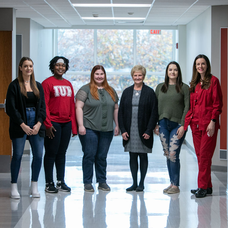 Six women pose for a picture