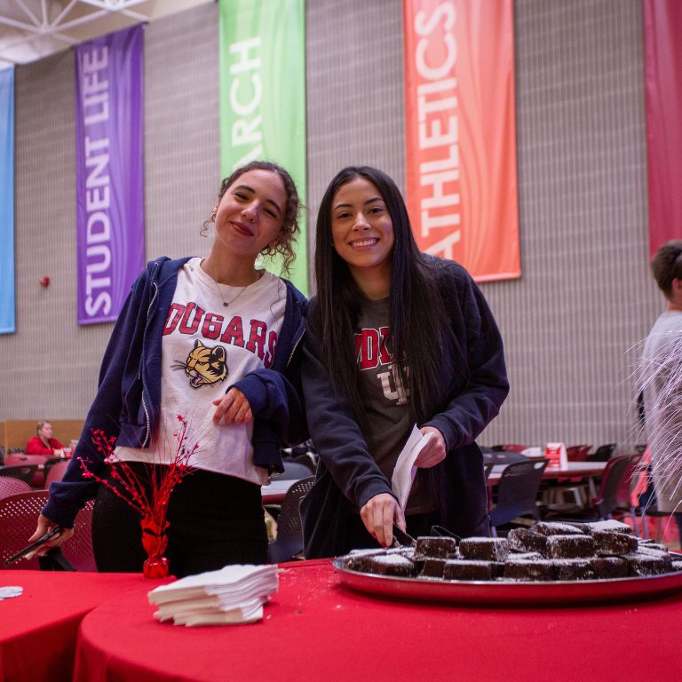 Two women smile for a picture