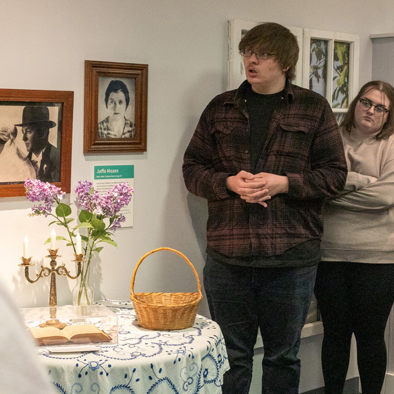 Two people look at museum exhibits.