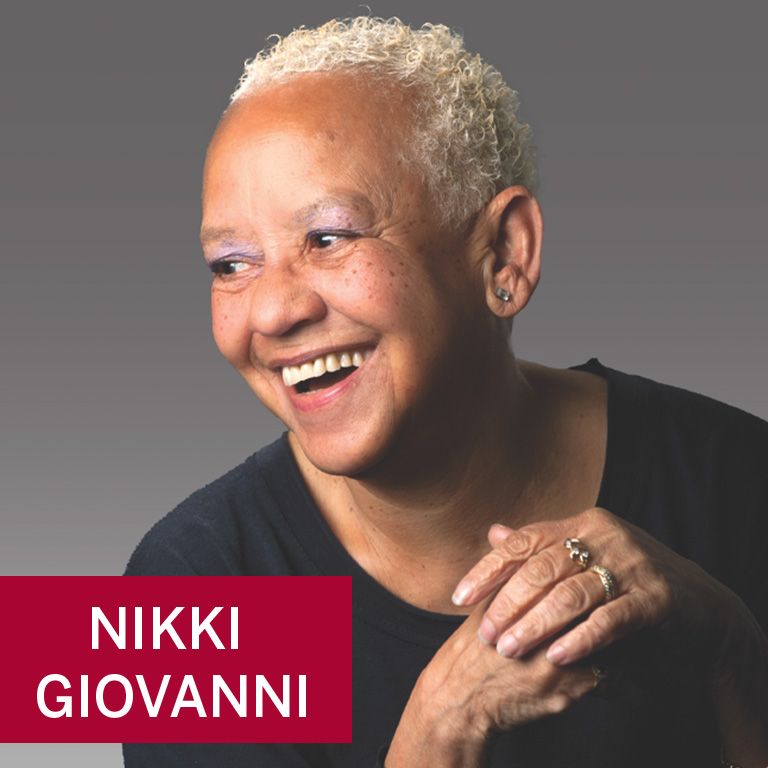 A woman smiles for a portrait