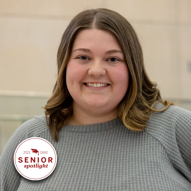 A woman smiles for a picture.