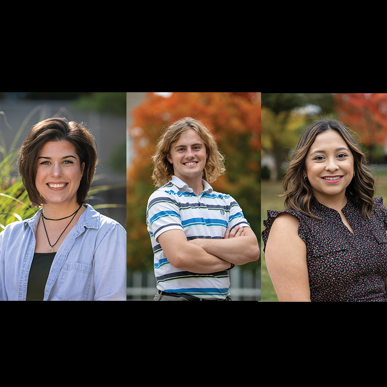 Two women and one man pose for a picture