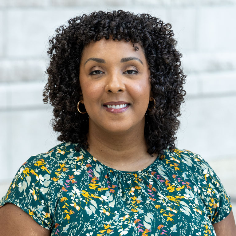 a woman poses for a portrait