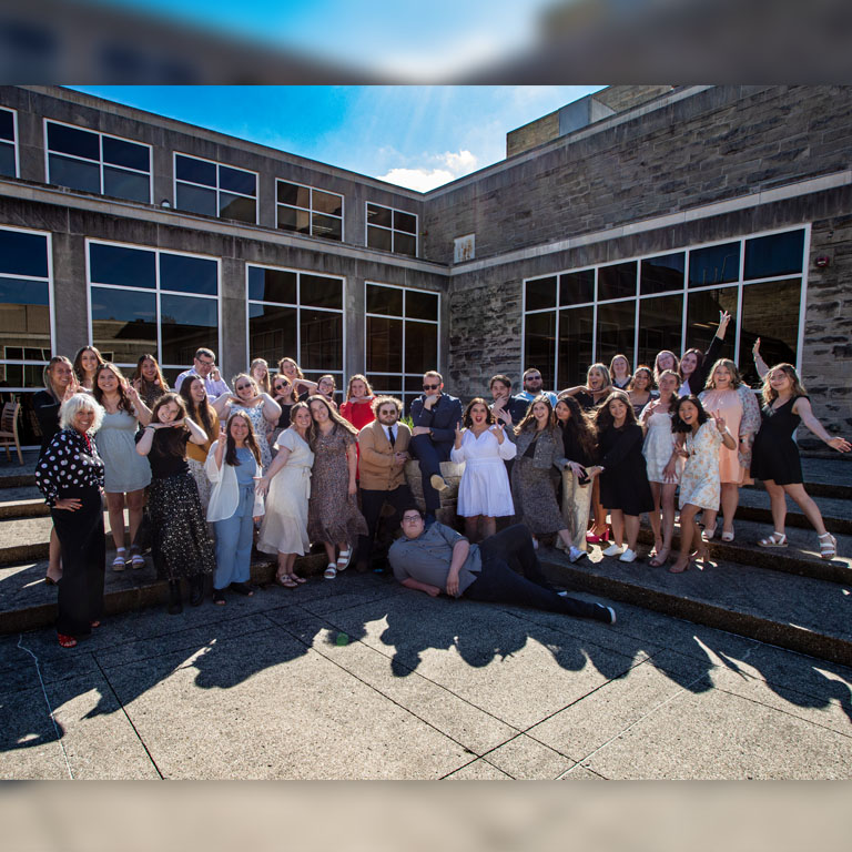 A group of people pose for a picture